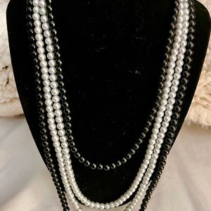 Costume jewelry black and white pearl necklace